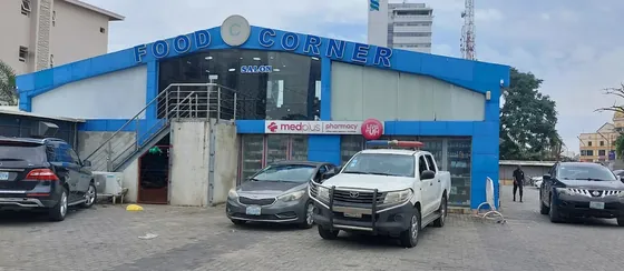 The Food Corner building on Adeola Odeku Street, with the salon on the upper floor above the Medplus pharmacy